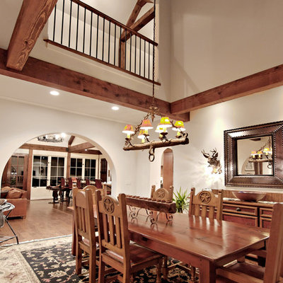 Mountain style dark wood floor dining room photo in Atlanta with white walls