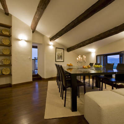 Inspiration for a mediterranean dark wood floor dining room remodel in Marseille with beige walls