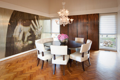Dining room - modern medium tone wood floor dining room idea in Miami with no fireplace and metallic walls