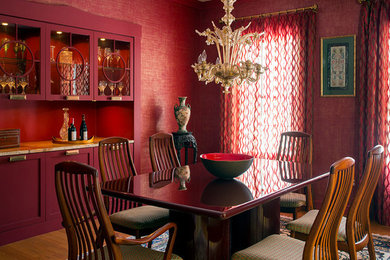 Example of a mid-sized transitional dining room design in Boston with red walls