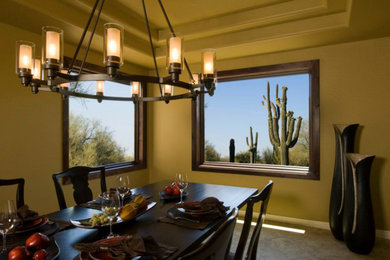 Inspiration for a large kitchen/dining room in Phoenix with yellow walls, ceramic flooring and no fireplace.