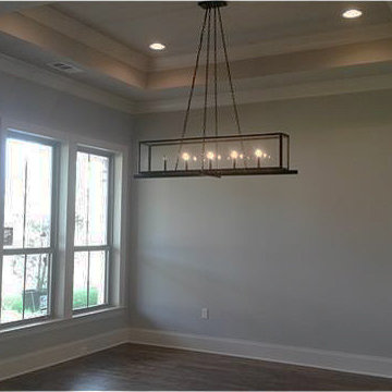 Dining Room includes a stepped ceiling and chandelier