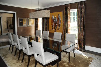 This is an example of a large contemporary enclosed dining room in New York with brown walls, dark hardwood flooring, no fireplace and brown floors.