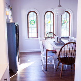 Inspiration for a country dining room in Indianapolis with medium hardwood floors.