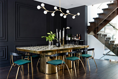 Design ideas for a medium sized contemporary open plan dining room in Toronto with black walls.