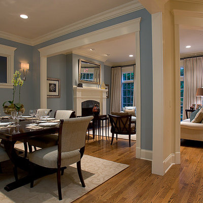 Example of a classic brown floor great room design in Chicago with blue walls