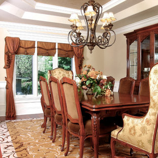 Enclosed dining room - large traditional dark wood floor enclosed dining room idea in Chicago with beige walls