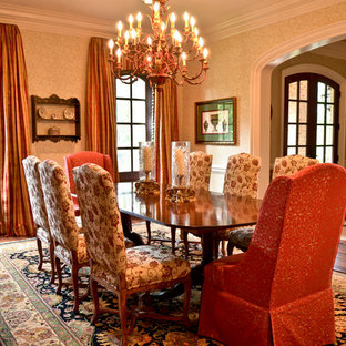 Inspiration for a large timeless medium tone wood floor enclosed dining room remodel in Atlanta with yellow walls and no fireplace
