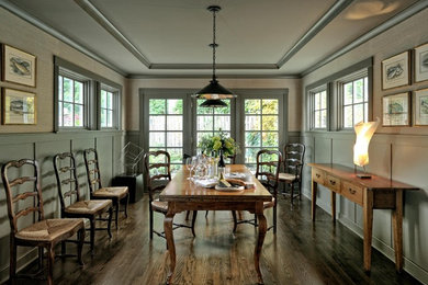 Example of a classic dark wood floor dining room design in Seattle with gray walls