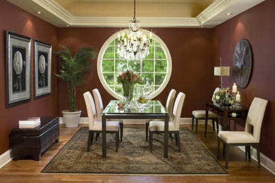 Enclosed dining room - mid-sized transitional medium tone wood floor and brown floor enclosed dining room idea in Boston with brown walls and no fireplace