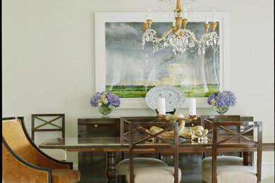Mid-sized elegant medium tone wood floor dining room photo in Boston with beige walls and no fireplace