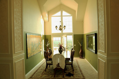 Medium sized traditional enclosed dining room in Boise with green walls, carpet, no fireplace and beige floors.