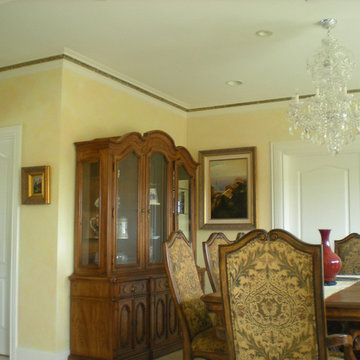 Dining room with decorative wall finish.