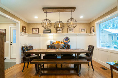 Dining room - medium tone wood floor dining room idea in Atlanta with white walls