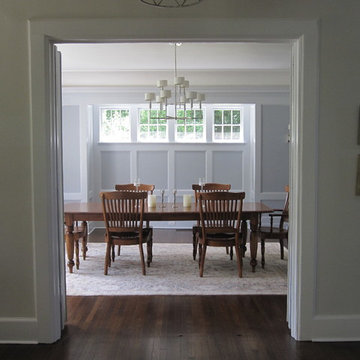 Dining room with painted wood paneling