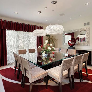 Dining Room with Square Table, Glass Pendants and Red Accents