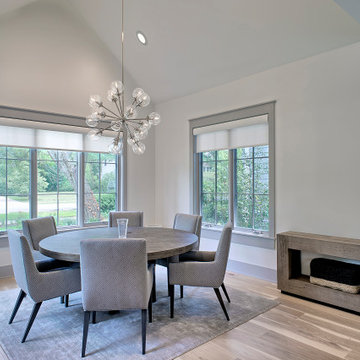 Dining Room with Vaulted Ceiling and Clear Glass Chandelier