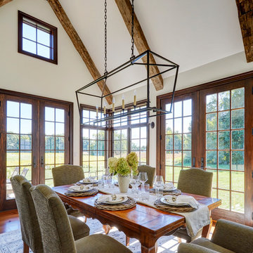 Dining Room with Vaulted Ceiling and Hand Hewn Beams