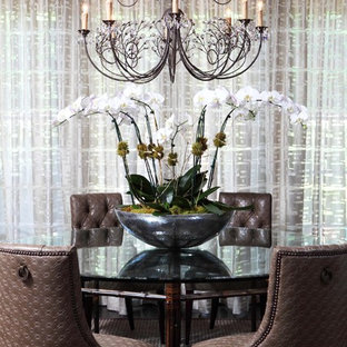 Example of a large eclectic dark wood floor enclosed dining room design in Orlando with white walls