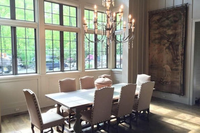 Inspiration for a mid-sized contemporary light wood floor and beige floor enclosed dining room remodel in Charlotte with white walls