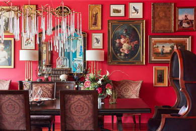 Inspiration for a timeless dining room remodel in Chicago with red walls