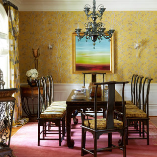Design ideas for a dining room in Chicago with yellow walls, medium hardwood floors and brown floor.