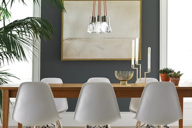 Example of a trendy light wood floor dining room design in Montreal with gray walls