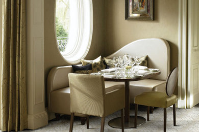 Example of a small ornate carpeted dining room design in Other with brown walls