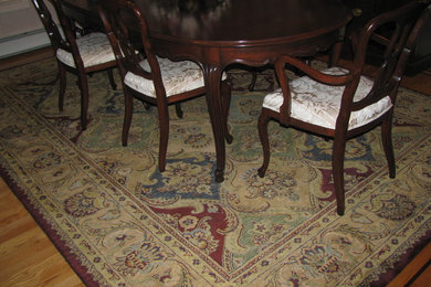 Example of a large classic medium tone wood floor enclosed dining room design in New York