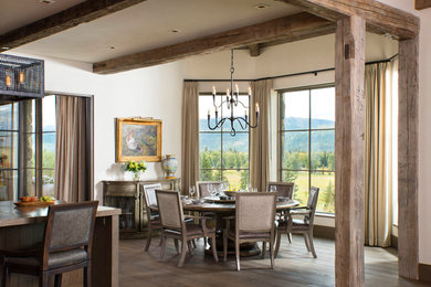 Dining room - rustic dark wood floor dining room idea in Other with white walls and no fireplace