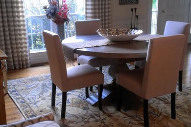 This is an example of a medium sized classic open plan dining room in Richmond with white walls, light hardwood flooring and no fireplace.