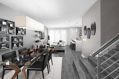 Idee per una sala da pranzo aperta verso il soggiorno minimalista con pareti grigie, pavimento in gres porcellanato e pavimento grigio