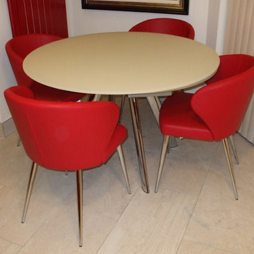 Doris P Chairs in Red Leather with a Myles Extending Table