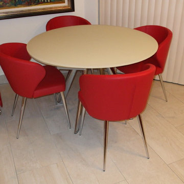Doris P Chairs in Red Leather with a Myles Extending Table