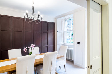 This is an example of a contemporary kitchen/dining room in Edinburgh.