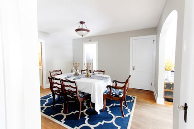 Inspiration for a small eclectic light wood floor enclosed dining room remodel in Baltimore with gray walls and no fireplace