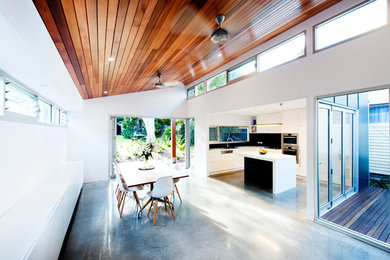 This is an example of a contemporary dining room in Sydney.