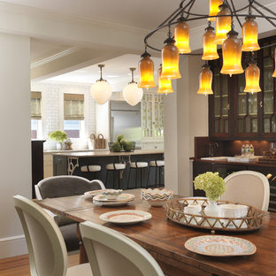 Inspiration for a timeless medium tone wood floor dining room remodel in Providence with white walls