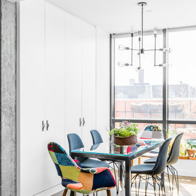 Small trendy dark wood floor kitchen/dining room combo photo in New York with white walls