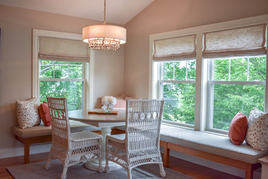 Example of a beach style dining room design in Portland Maine with gray walls