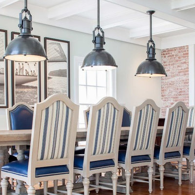 Beach style medium tone wood floor dining room photo in Baltimore with white walls