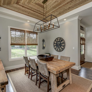 Cottage dark wood floor and brown floor dining room photo in Atlanta with gray walls