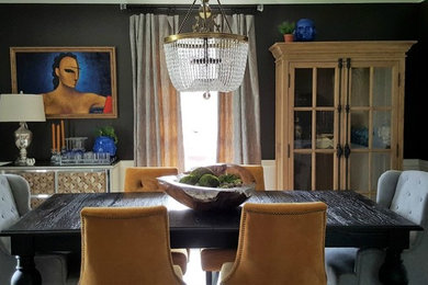 Example of a mid-sized transitional dining room design in New Orleans with black walls