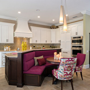 Inspiration for an eclectic brown floor kitchen/dining room combo remodel in Miami with beige walls