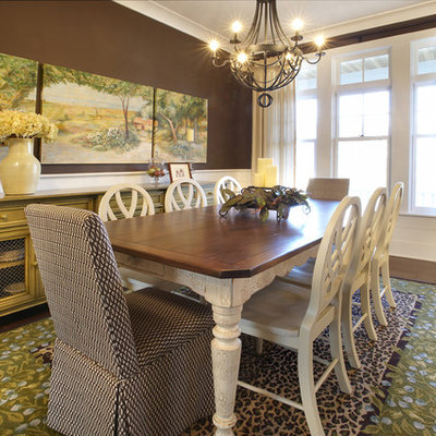 Example of an eclectic dark wood floor dining room design in Chicago with brown walls