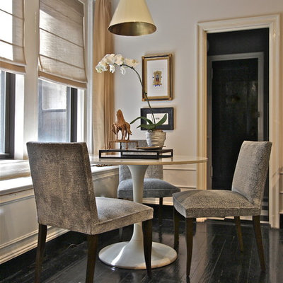 Inspiration for a large eclectic painted wood floor and black floor enclosed dining room remodel in Other with white walls