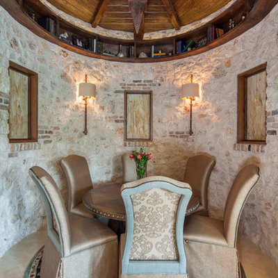 Example of a tuscan kitchen/dining room combo design in Austin with beige walls
