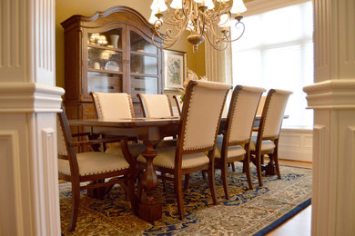 Inspiration for a medium sized classic open plan dining room in Indianapolis with beige walls, medium hardwood flooring and brown floors.