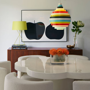 Immagine di una sala da pranzo minimalista con pareti bianche