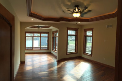 Example of a large classic vinyl floor enclosed dining room design in Phoenix with beige walls and no fireplace